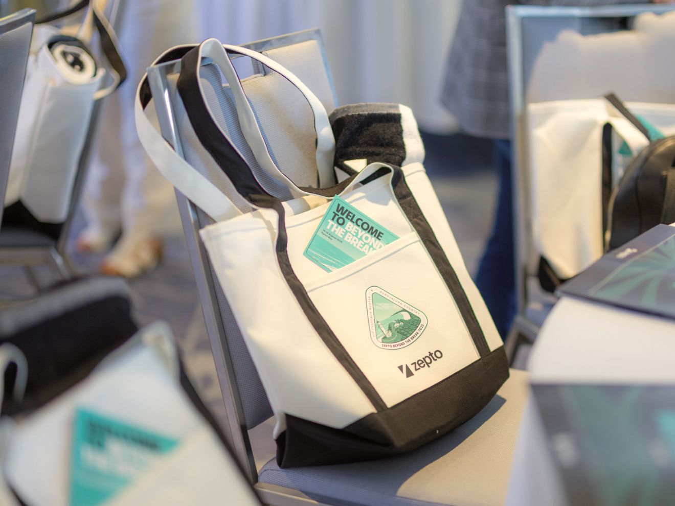 Zepto event bag with sticker and flyer designed by Oliver Grace